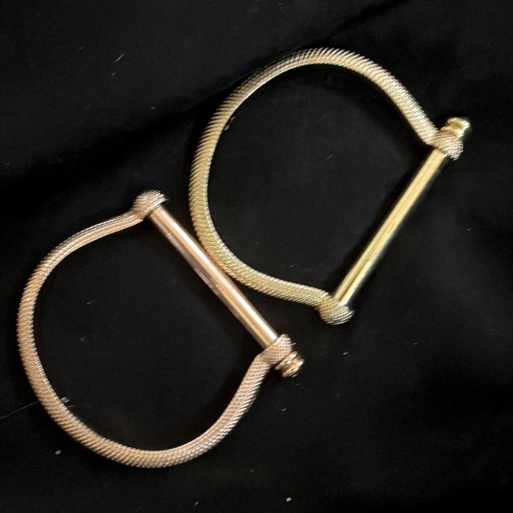 Gallop away with a set of Gold and Bronze horse shaped bracelets
